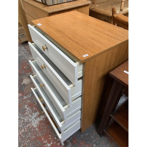 205 - A Schreiber teak effect and white laminate chest of drawers - approx. 87cm high x 60cm wide x 40cm d... 