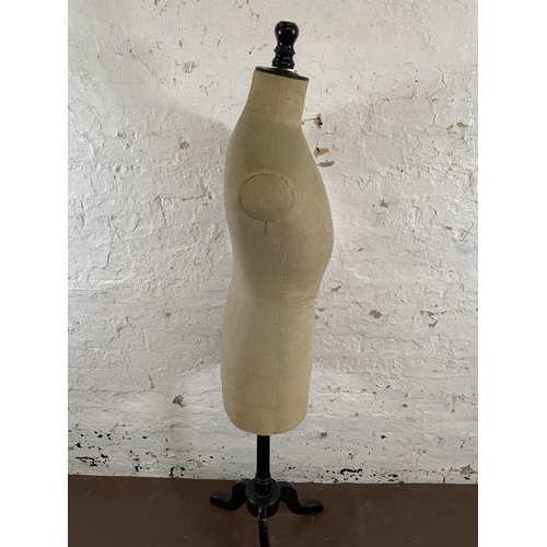 208 - An early 20th century fabric and ebonized female mannequin torso on tripod pedestal - approx. 157cm ... 