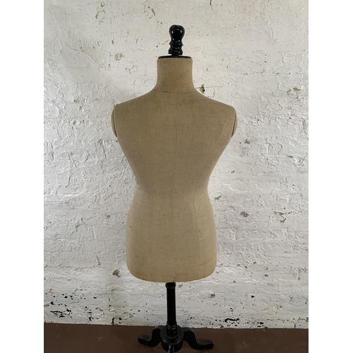 208 - An early 20th century fabric and ebonized female mannequin torso on tripod pedestal - approx. 157cm ... 