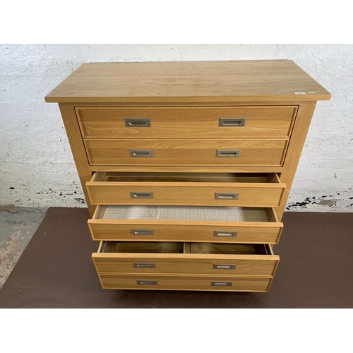 209 - A modern oak secretaire chest of drawers - approx. 114cm high x 111cm wide x 50cm deep