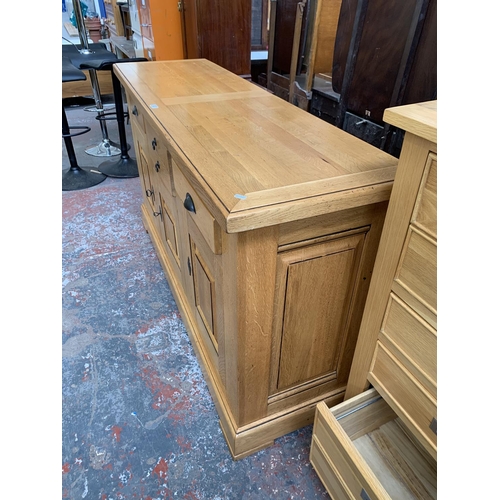 211 - A modern solid oak sideboard - approx. 97cm high x 168cm wide x 50cm deep