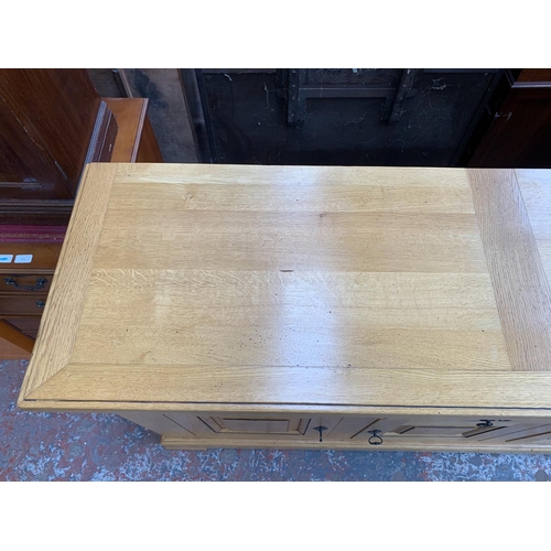 211 - A modern solid oak sideboard - approx. 97cm high x 168cm wide x 50cm deep