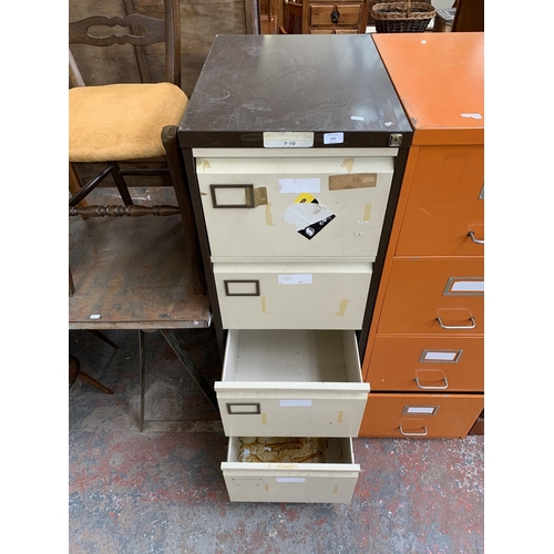 215 - A brown and cream metal four drawer office filing cabinet - approx. 132cm high x 46cm wide x 63cm de... 