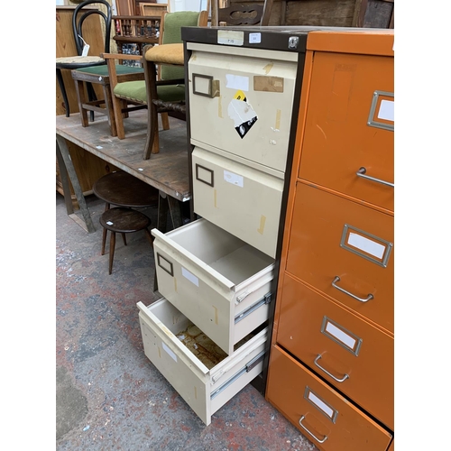 215 - A brown and cream metal four drawer office filing cabinet - approx. 132cm high x 46cm wide x 63cm de... 