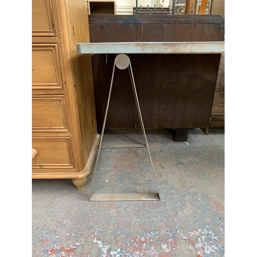 217 - A vintage steel table top on trestle base - approx. 77cm high x 70cm wide x 160cm long