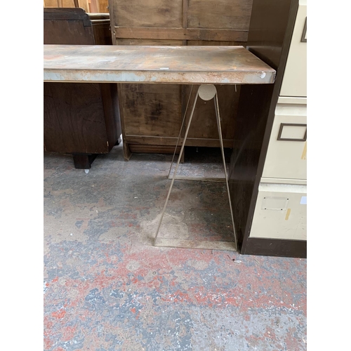 217 - A vintage steel table top on trestle base - approx. 77cm high x 70cm wide x 160cm long