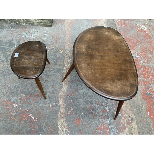 218 - A mid 20th century Ercol No. 354 elm and beech pebble nest of two tables - largest approx. 40cm high... 