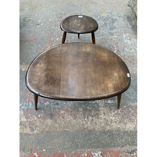 218 - A mid 20th century Ercol No. 354 elm and beech pebble nest of two tables - largest approx. 40cm high... 