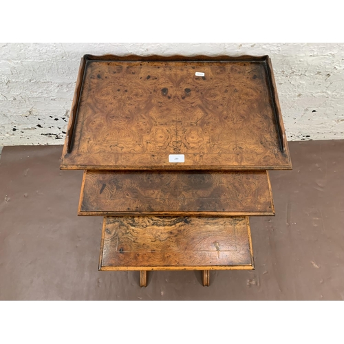 220 - A 19th century style burr walnut and mahogany nest of three tables - largest approx. 60cm high x 56c... 