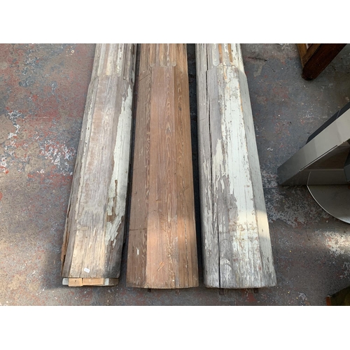 222 - Three 19th century pitch pine Corinthian pillars - largest approx. 281cm