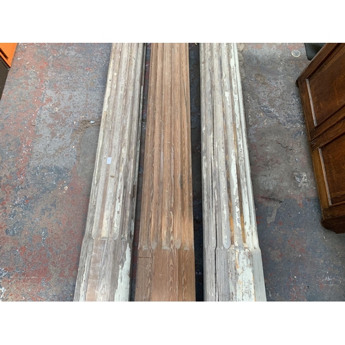 222 - Three 19th century pitch pine Corinthian pillars - largest approx. 281cm