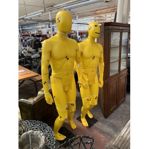 224 - A pair of polystyrene mannequins in the form of crash test dummies - approx. 193cm high