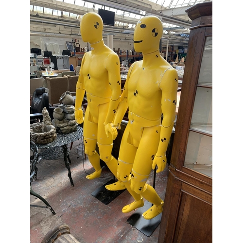 224 - A pair of polystyrene mannequins in the form of crash test dummies - approx. 193cm high