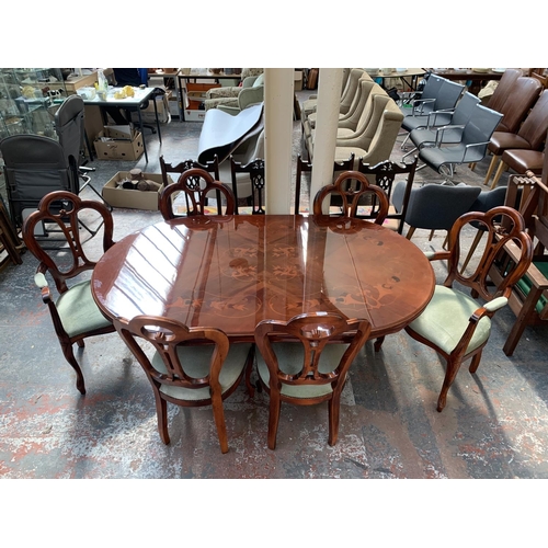 231 - An Italian style inlaid walnut effect pedestal dining table and six chairs - approx. 78cm high x 110... 