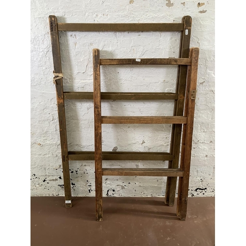 232 - Two early 20th century wooden folding towel rails