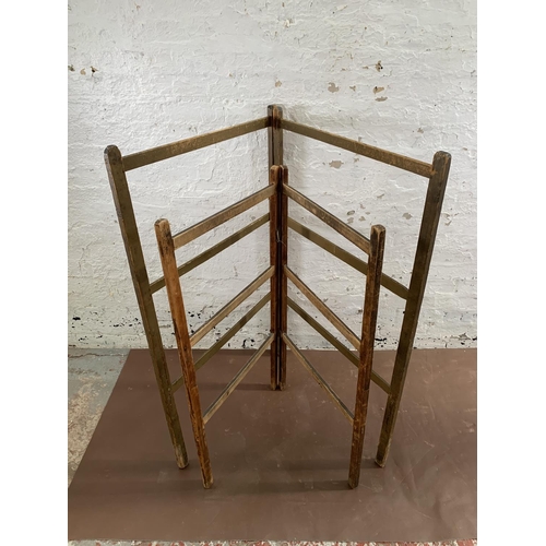 232 - Two early 20th century wooden folding towel rails