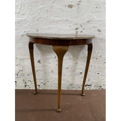 233 - A mahogany veneer serpentine console table on cabriole supports - approx. 73cm high x 70cm wide x 37... 