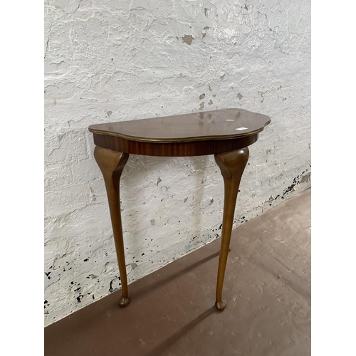 233 - A mahogany veneer serpentine console table on cabriole supports - approx. 73cm high x 70cm wide x 37... 