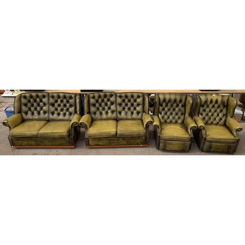 237 - An olive green leather Chesterfield four piece lounge suite comprising two reclining armchairs and t... 