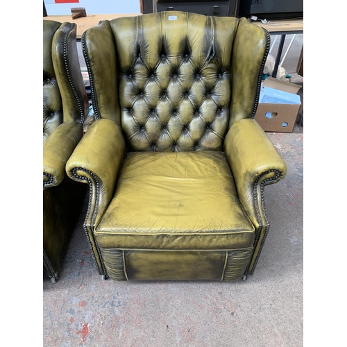 237 - An olive green leather Chesterfield four piece lounge suite comprising two reclining armchairs and t... 