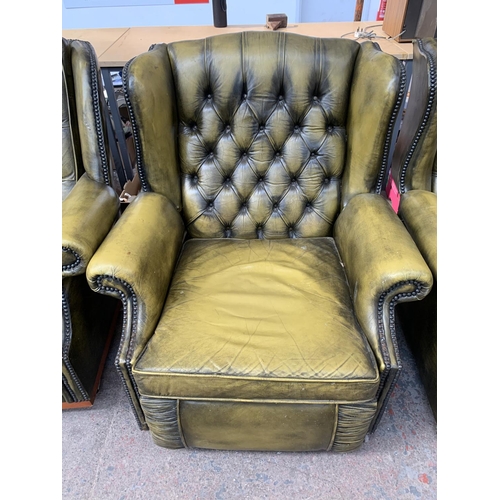 237 - An olive green leather Chesterfield four piece lounge suite comprising two reclining armchairs and t... 