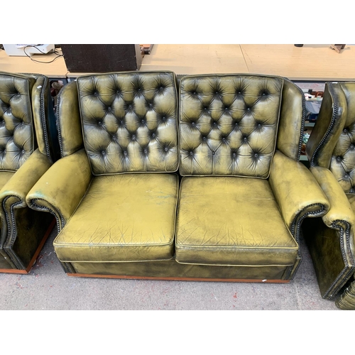 237 - An olive green leather Chesterfield four piece lounge suite comprising two reclining armchairs and t... 