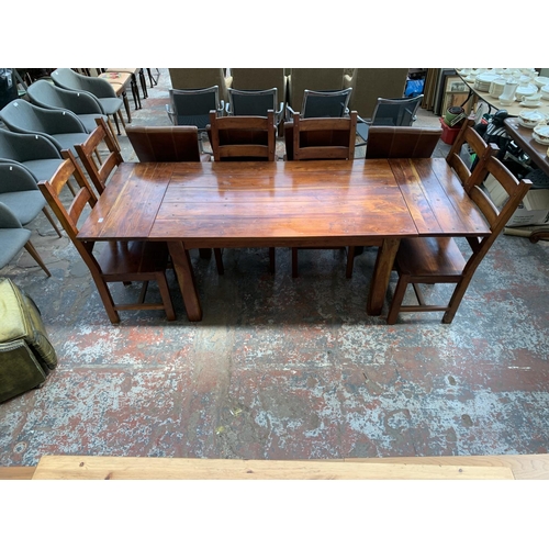 238 - An Indian sheesham wood extendable dining table and six chairs - approx. 76cm high x 90cm wide x 230... 