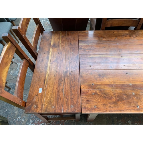 238 - An Indian sheesham wood extendable dining table and six chairs - approx. 76cm high x 90cm wide x 230... 