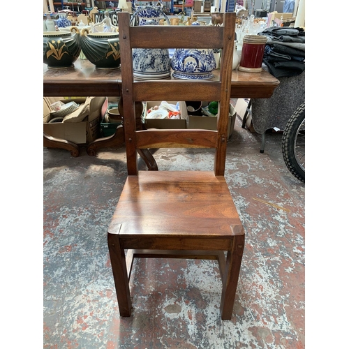 238 - An Indian sheesham wood extendable dining table and six chairs - approx. 76cm high x 90cm wide x 230... 