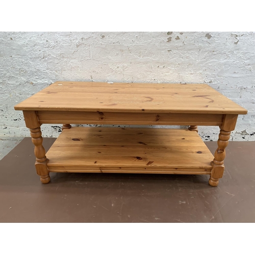 239 - A pine rectangular two tier coffee table - approx. 47cm high x 53cm wide x 105cm long