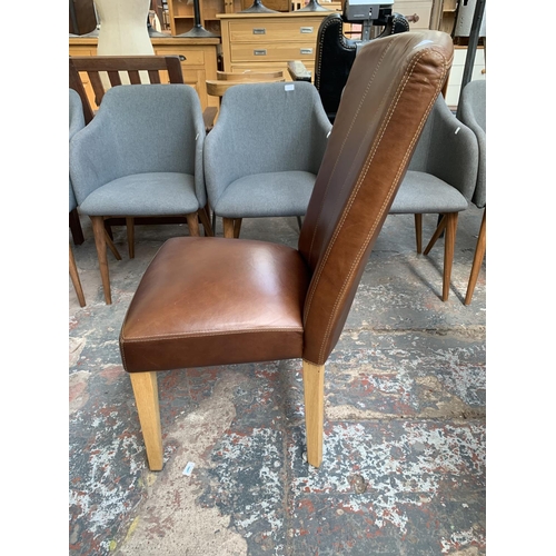 240 - Four modern brown leather dining chairs on oak supports