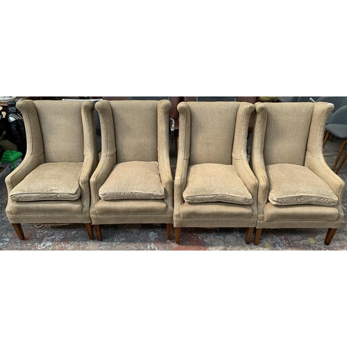 242 - Four 19th century style fabric upholstered wingback arm chairs - approx. 102cm high x 61cm wide x 70... 