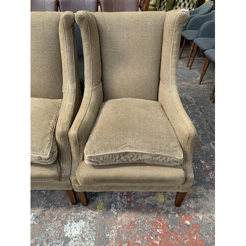 242 - Four 19th century style fabric upholstered wingback arm chairs - approx. 102cm high x 61cm wide x 70... 