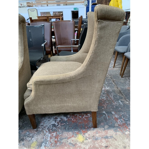 242 - Four 19th century style fabric upholstered wingback arm chairs - approx. 102cm high x 61cm wide x 70... 