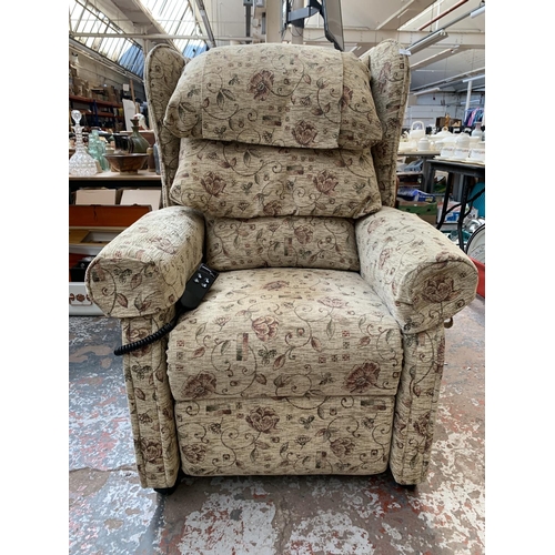 243 - An Ableworld 'The Cheshire' fabric upholstered riser recliner arm chair with remote and power supply... 