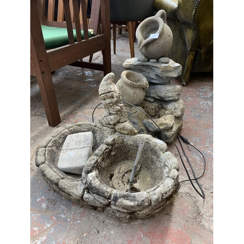 250 - Two garden water features, one cast stone and one fibreglass - approx. 54cm high