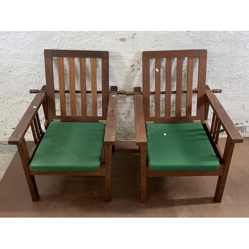 250A - A pair of teak reclining garden armchairs - approx. 93cm high x 65cm wide x 80cm deep