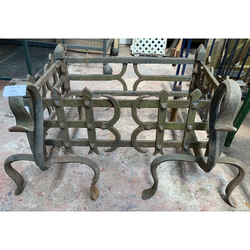 251 - A cast and wrought iron fire grate - approx. 36cm high x 63cm wide x 46cm deep