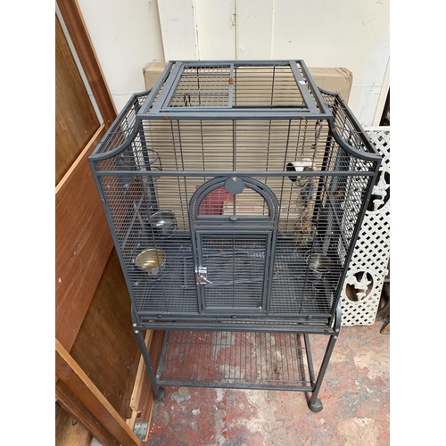 253 - A grey painted metal bird cage on castors - approx. 142cm high x 70cm wide x 45cm deep