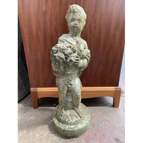 262 - A pair of cast stone garden statues - approx. 60cm high