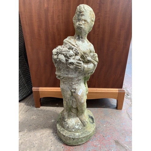 262 - A pair of cast stone garden statues - approx. 60cm high