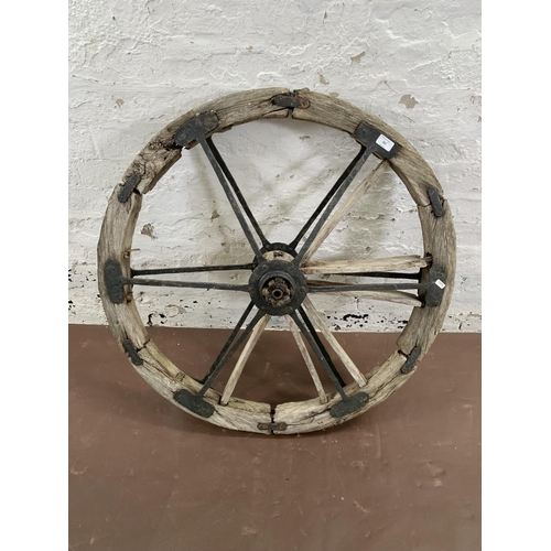 263 - A 19th century wood and metal cartwheel - approx. 88cm diameter