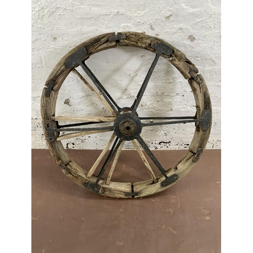 263 - A 19th century wood and metal cartwheel - approx. 88cm diameter