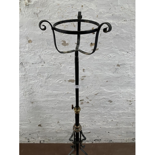 270 - Two wrought metal items, one 19th century telescopic tripod floor lantern - approx. 134cm high and o... 