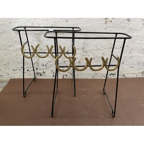 272 - A pair of wrought metal free standing garden planters with horseshoe design - approx. 72cm high x 62... 