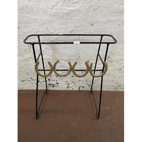 272 - A pair of wrought metal free standing garden planters with horseshoe design - approx. 72cm high x 62... 