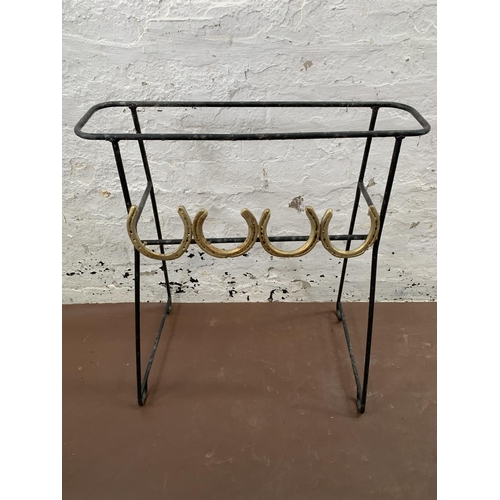 272 - A pair of wrought metal free standing garden planters with horseshoe design - approx. 72cm high x 62... 