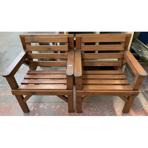 277 - A pair of pine slatted garden armchairs - approx. 80cm high x 67cm wide x 59cm deep