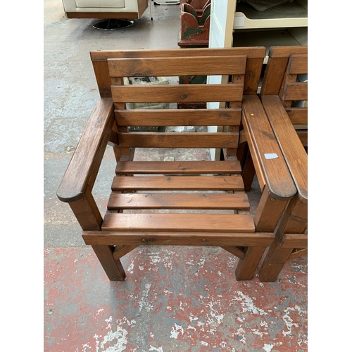 277 - A pair of pine slatted garden armchairs - approx. 80cm high x 67cm wide x 59cm deep