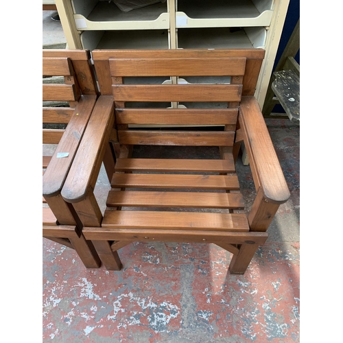 277 - A pair of pine slatted garden armchairs - approx. 80cm high x 67cm wide x 59cm deep